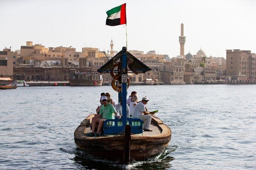 Travelers ride an “Abra” water taxi on Dubai Creek.