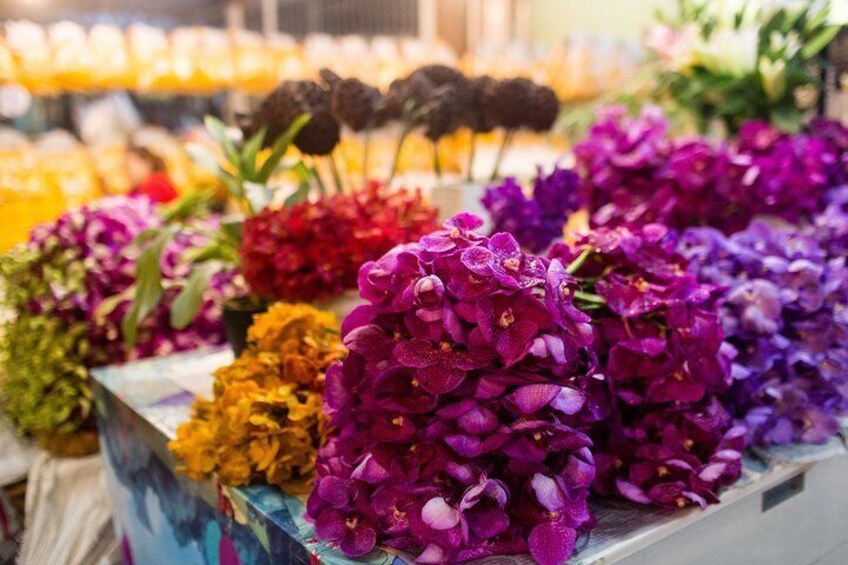 Vendors at Pak Klong Talat Flower Market sell flowers wholesale as well as hand-strung garlands.