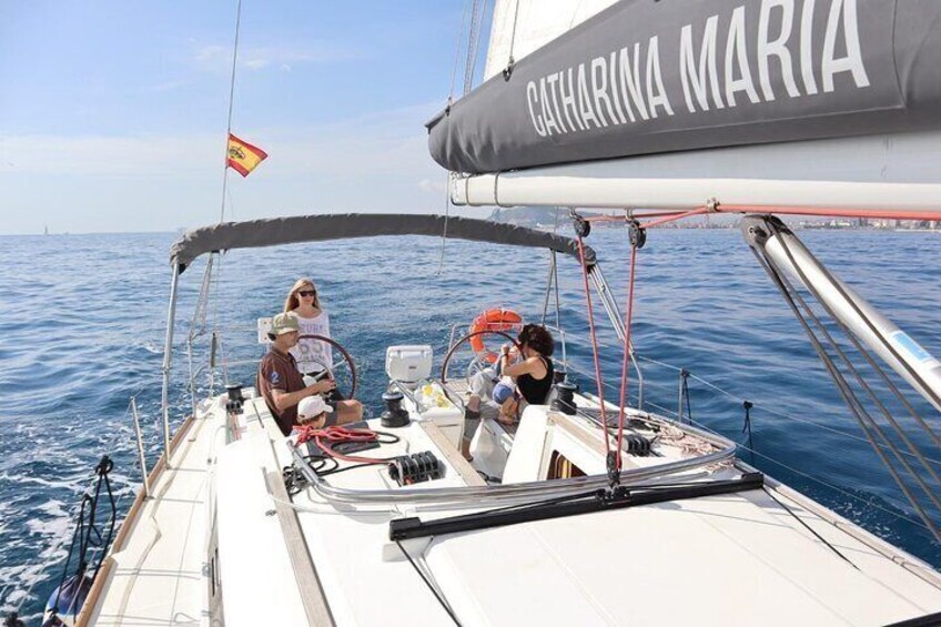 Small-Group Sail Trip in Barcelona with Paddle Boarding