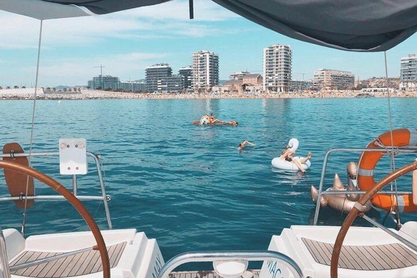 Small-Group Sail Trip in Barcelona with Paddle Boarding
