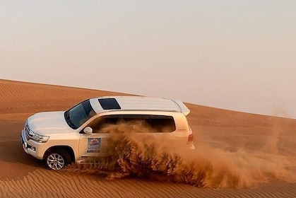 Private Dubai Desert Safari with BBQ Dinner & Sandboarding