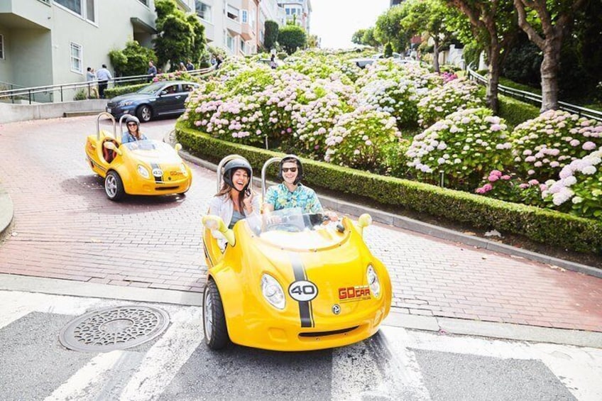 Bright yellow Go Cars make their way to the streets of San Francisco, California.