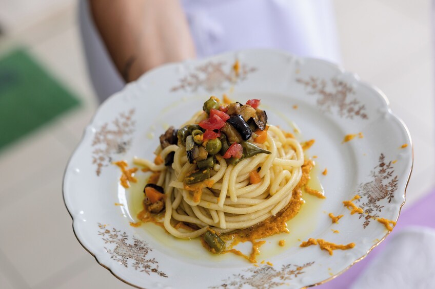 Show Cooking and Dining experience at a local's home in Taormina