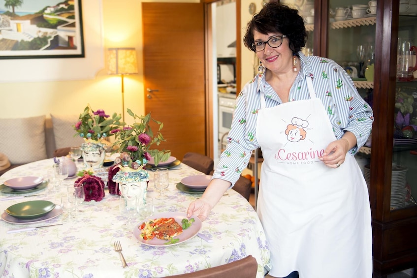 Show item 3 of 7. Dining experience at a local's home in Acitrezza