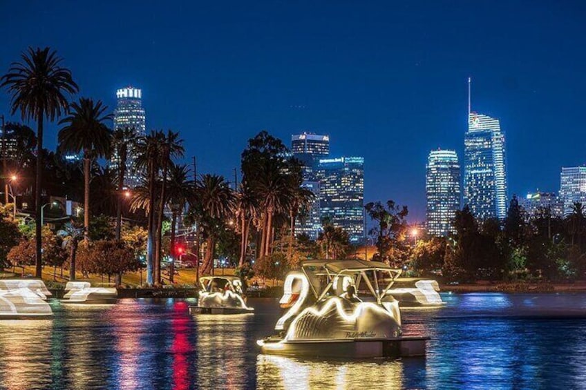 Swan pedal boat night rides under the sparkling LA skyline