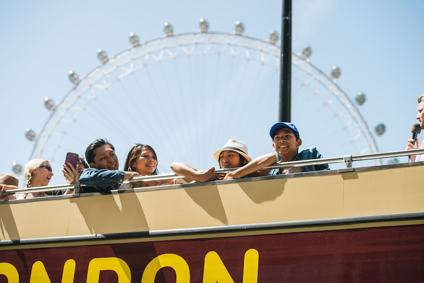 Double decker bus with London Eye in the background