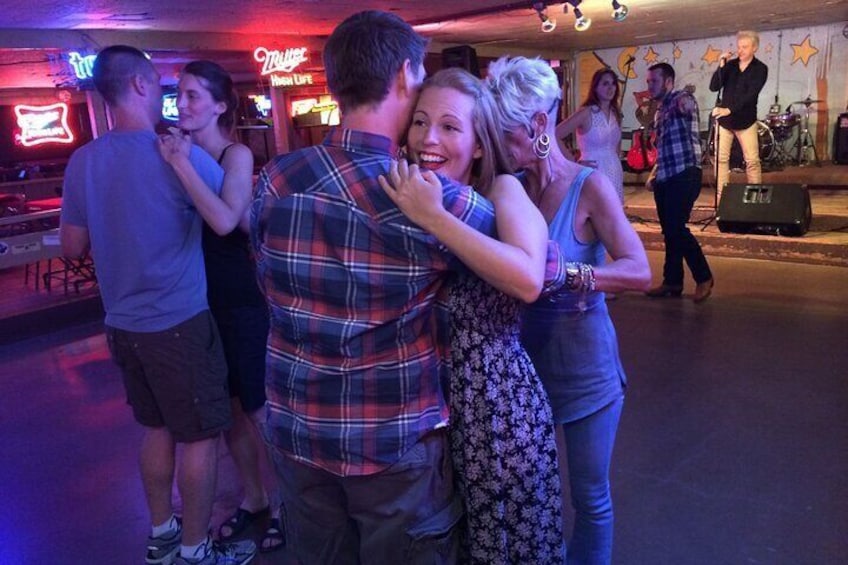 Couples dancing during a live music show