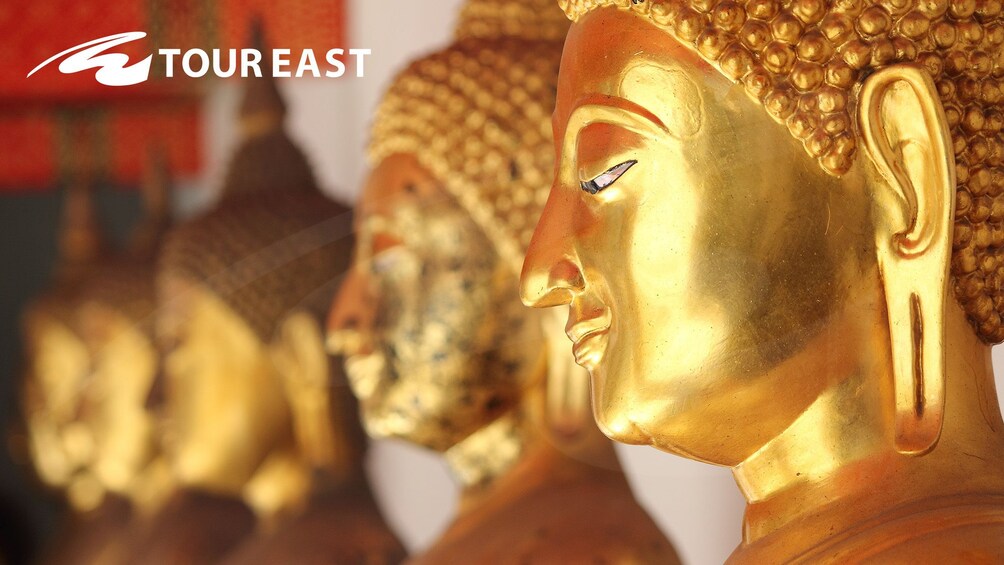 Closeup of golden Buddha statues in Bangkok