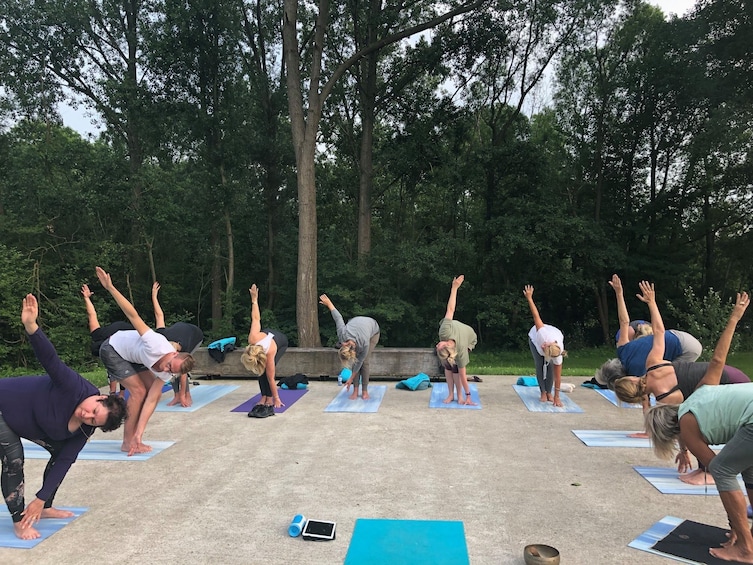 Yoga class by the water in small groups at Dolphin Wellness