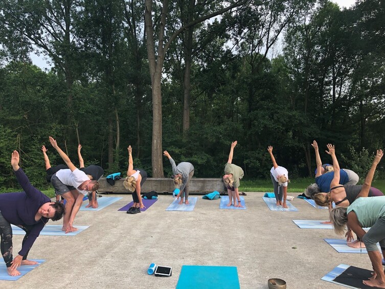Yoga class by the water in small groups at Dolphin Wellness