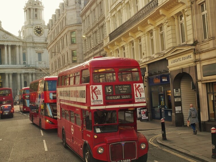 vintage red london bus tour with thames river cruise