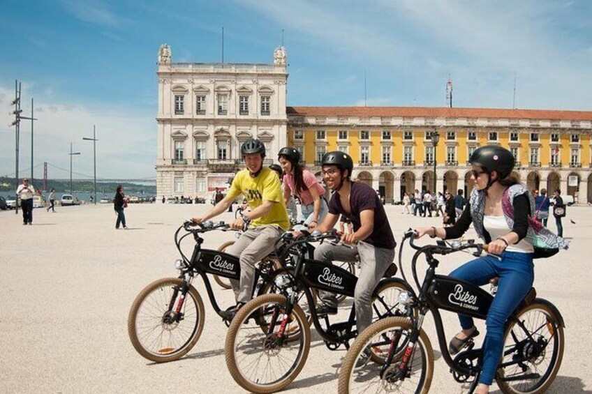 Get comfortable with your e-bike in Terreiro do Paço, also known as Praça do Comercio.
