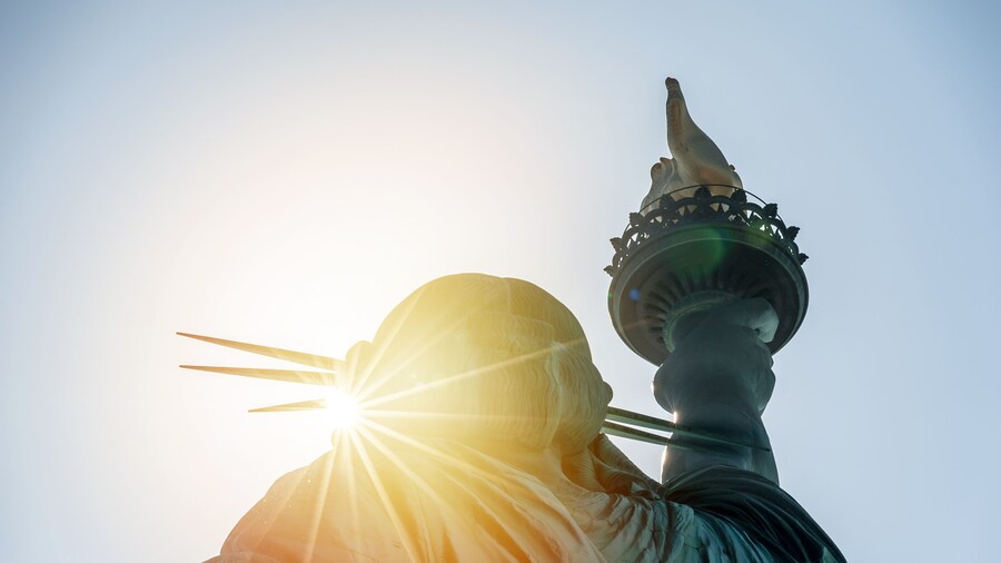 Sun peaking through the Statue of Liberty