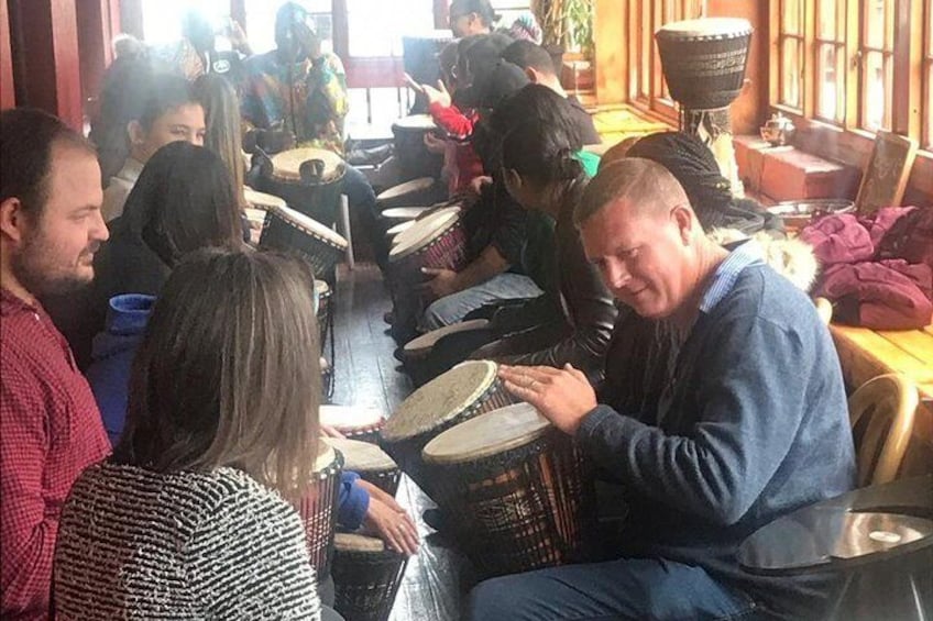Travellers learning how to drum ! 