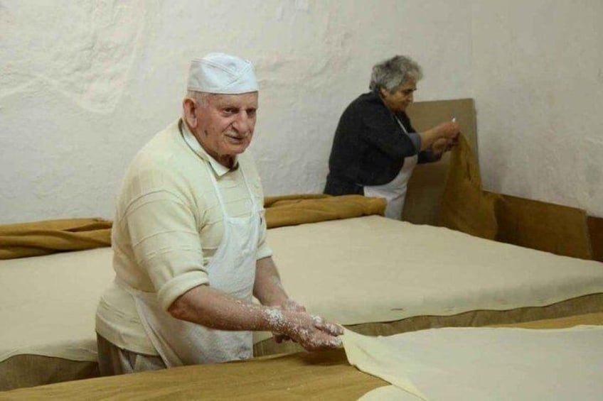 Giorgos Hatziparashos making phyllo dough