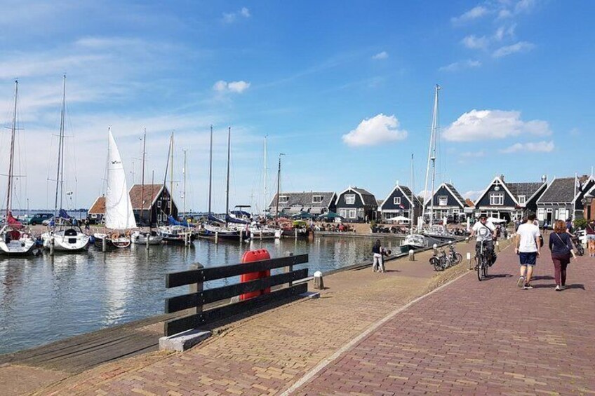 Charming port in Volendam with timbered houses in the background.