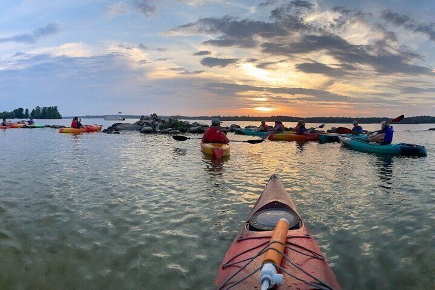 Floating on the lake, watching the sunset