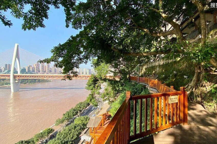 A cliff side board walk adjacent to Hongya Cave