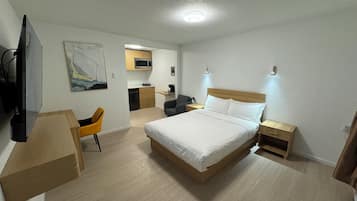 Habitación cuádruple Deluxe | Sábanas de algodón egipcio y ropa de cama de alta calidad