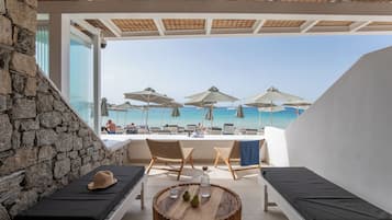 On the beach, sun-loungers, beach umbrellas, beach towels