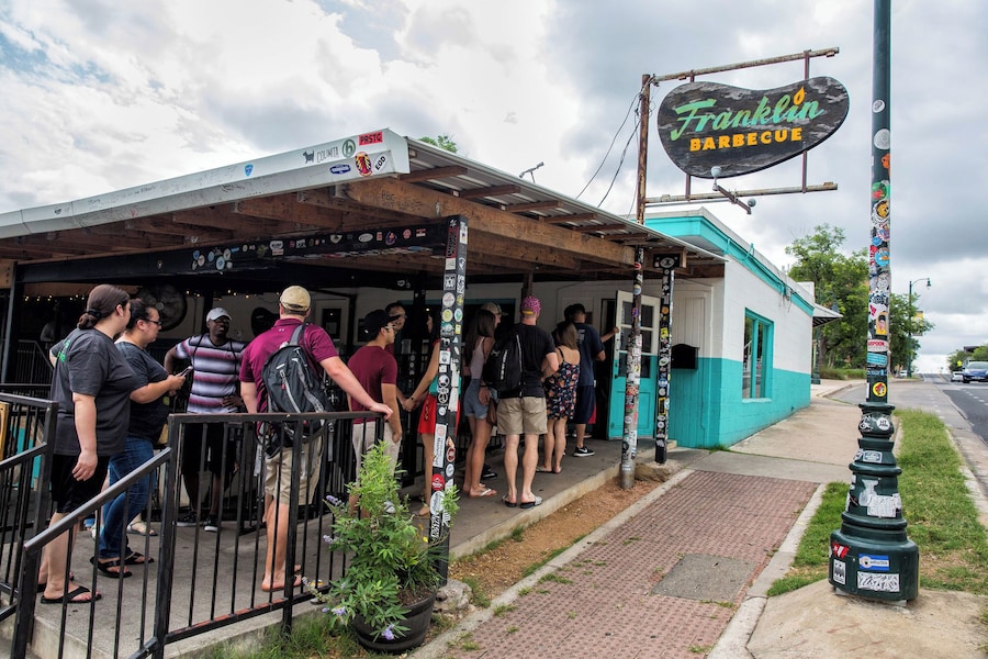 Franklin Barbecue with long lines and casual setting in Austin, Texas.