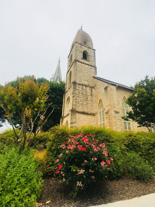 Neo-Gothic architecture of St. Mary Cathedral surrounded by greenery in Austin, Texas.