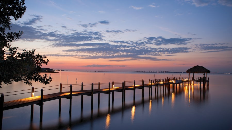 Sunset view of Okaloosa Island Pier stretching into the Gulf of Mexico in Destin, Florida.